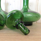 Empoli Green Glass Decanter Set with Stoppers and Wicker Basket Carrier, Italy 1960s